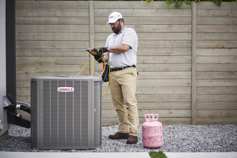 technician checking levels of heating unit after replacement